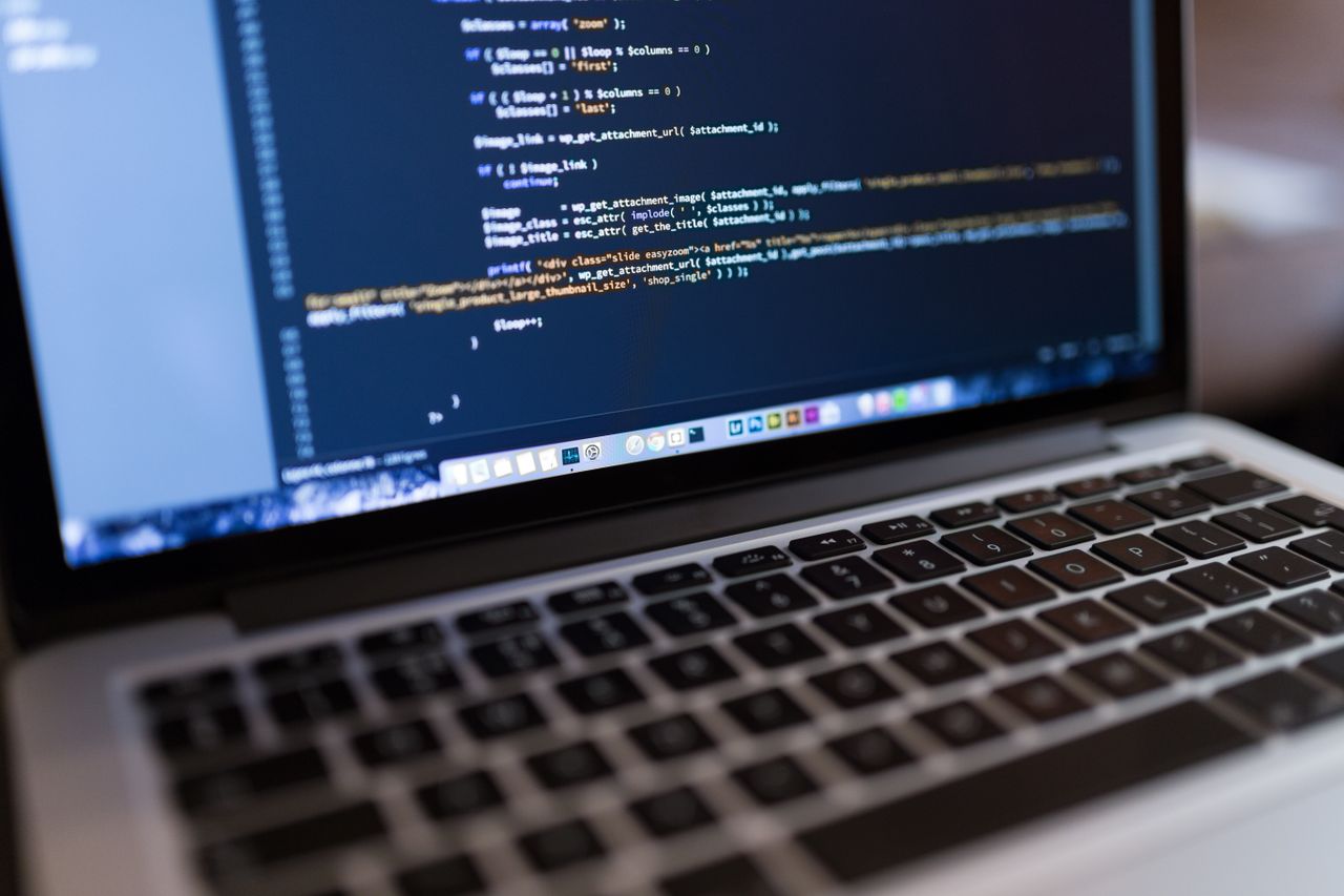 Mastering the First Impression: Your intriguing post title goes here Focused view of programming code displayed on a laptop, ideal for tech and coding themes.